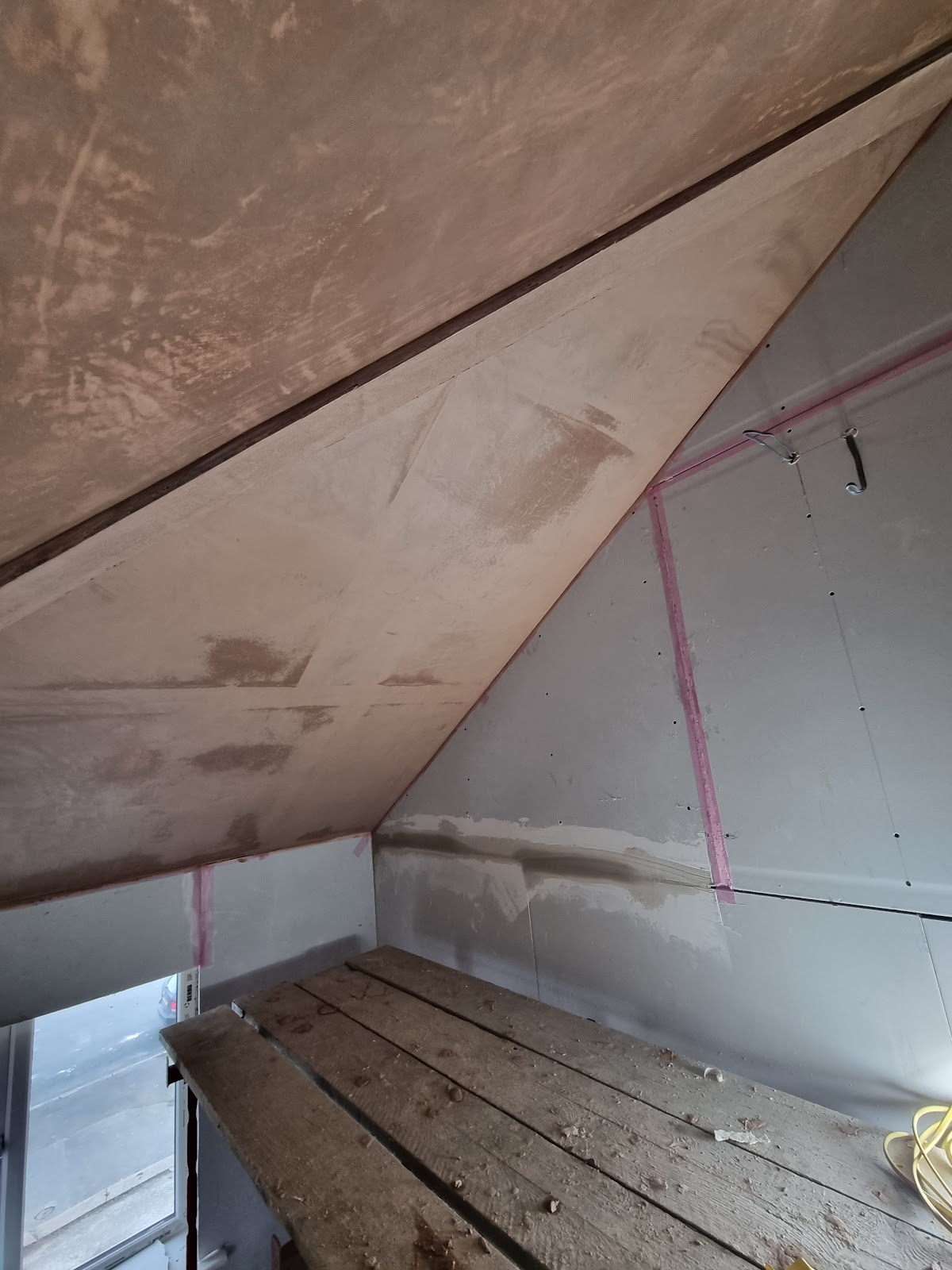 Loft conversion with plastered vaulted ceiling