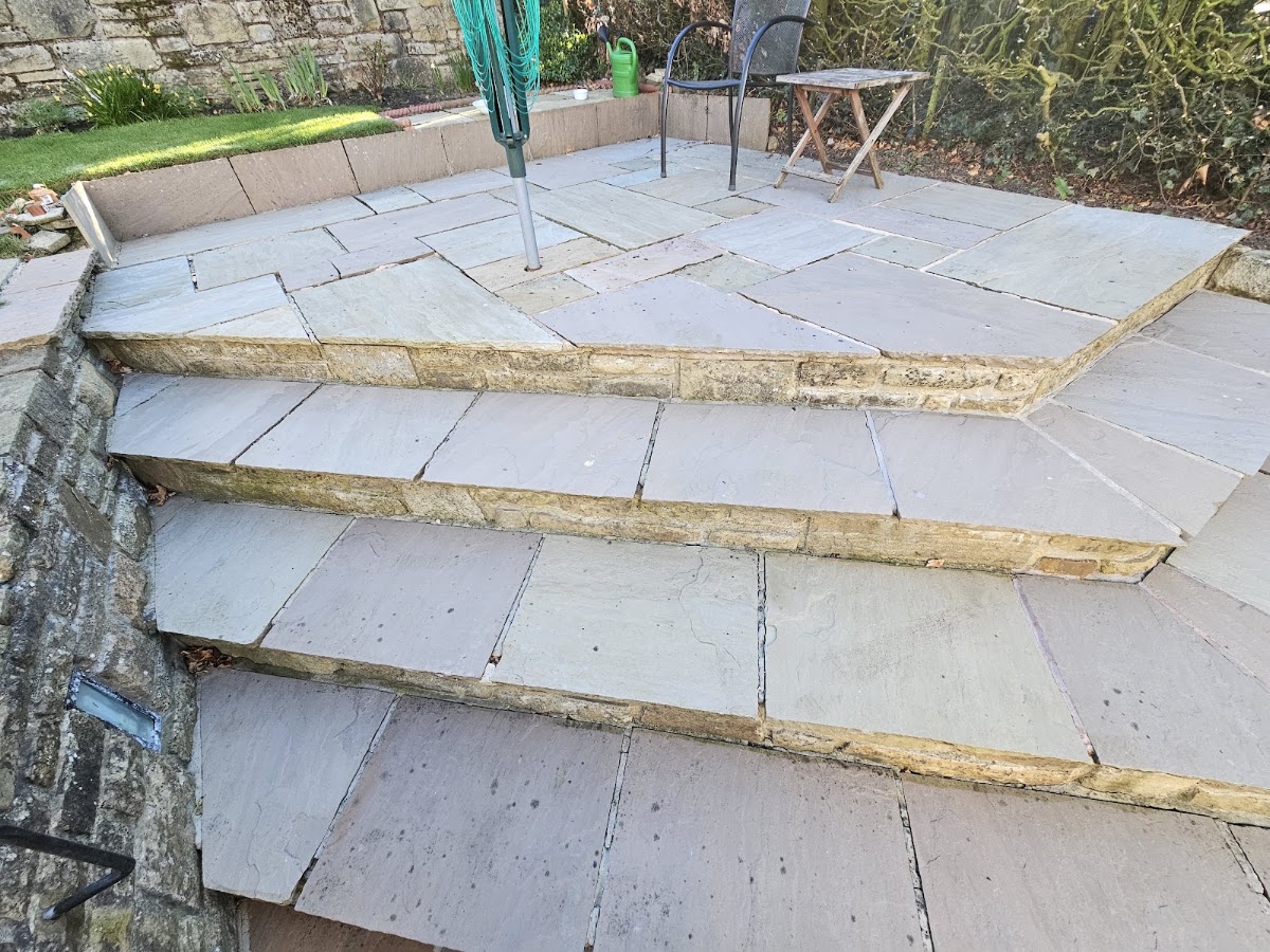 Indian sandstone patio and stone steps laid in a Yorkshire garden