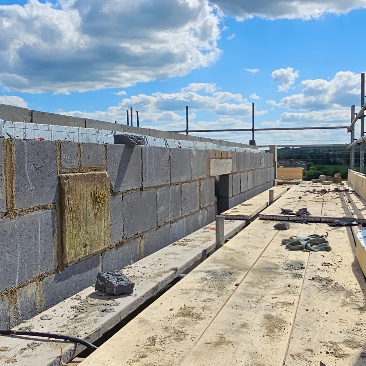 Blockwork extension wall built with Dales countryside behind